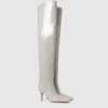 Bottes cuissardes à talons aiguilles et bout carré en cuir verni Bottes cuissardes à talons aiguilles et bout carré en cuir verni