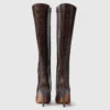 Bottes à talons aiguilles en cuir verni à bout carré et à hauteur du genou Bottes à talons aiguilles en cuir verni à bout carré et à hauteur du genou