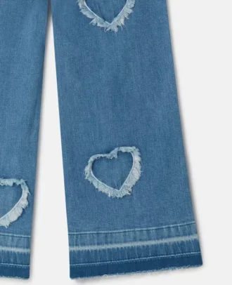 Jean en denim stretch avec patch cœur à franges