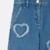Jean en denim stretch avec patch cœur à franges Jean en denim stretch avec patch cœur à franges