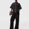 Jean à jambes larges et empiècements en satin Jean à jambes larges et empiècements en satin