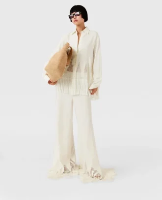 Pantalon large à franges et mailles ouvertes