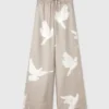 Pantalon oversize à cordon coulissant et imprimé colombes Pantalon oversize à cordon coulissant et imprimé colombes