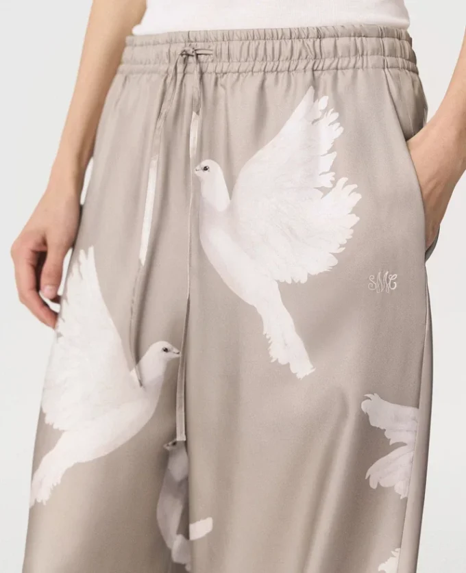 Pantalon oversize à cordon coulissant et imprimé colombes Pantalon oversize à cordon coulissant et imprimé colombes