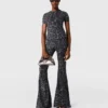 Pantalon évasé taille moyenne à imprimé léopard Pantalon évasé taille moyenne à imprimé léopard