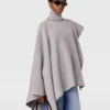 Poncho asymétrique à col roulé en maille Poncho asymétrique à col roulé en maille
