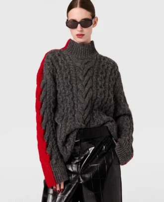 Pull à col roulé et manches lacées en maille torsadée